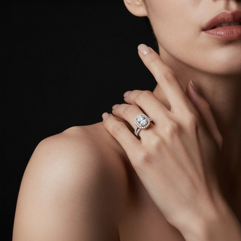 Model wearing oval double halo bridal set engagement ring set