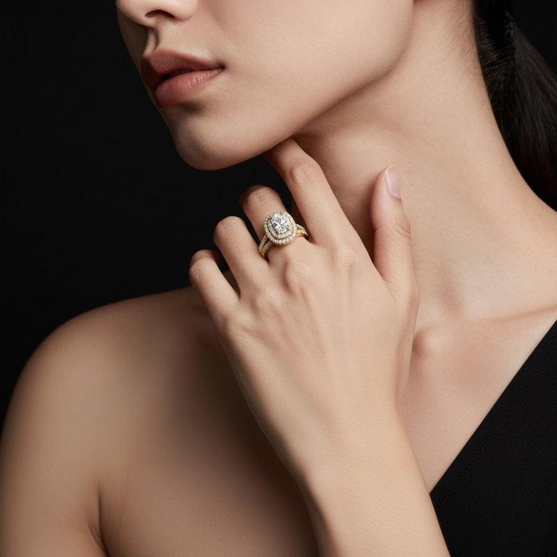 Model wearing pear double halo bridal set engagement ring set