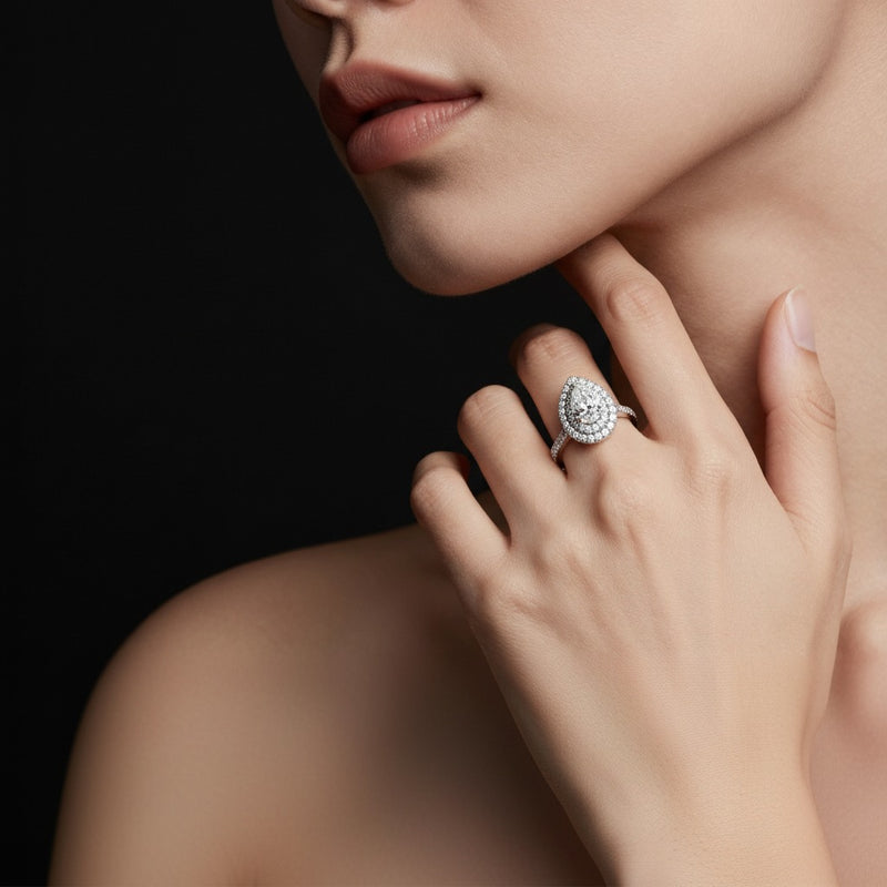Model wearing pear double halo engagement ring