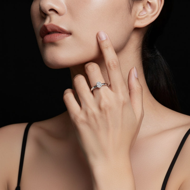 Model wearing oval split shank trellis engagement ring