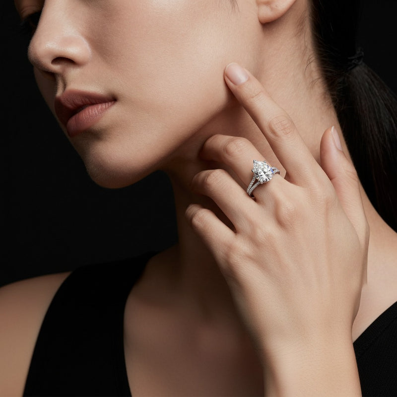 Model wearing pear split shank trellis engagement ring
