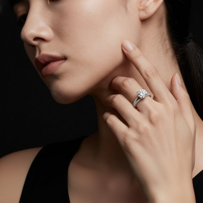 Model wearing round split shank trellis engagement ring