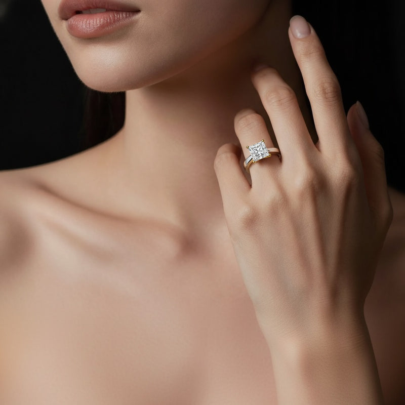 Model wearing princess two tone twisted basket cathedral shank solitaire ring