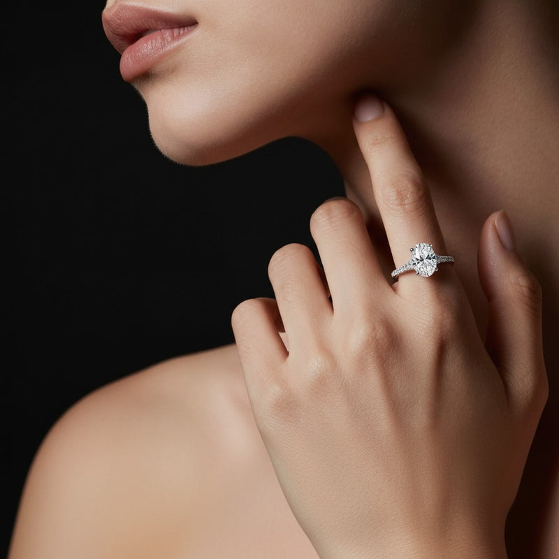 Model wearing oval accented two tone engagement ring