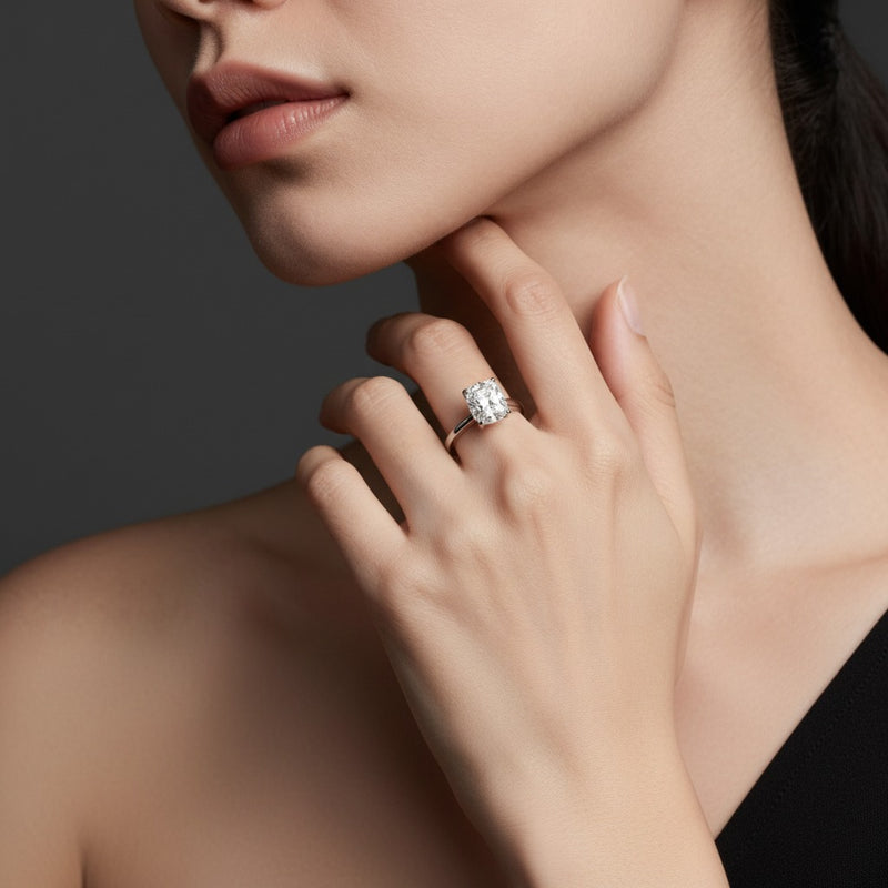 Model wearing cushion knife edge shank solitaire engagement ring