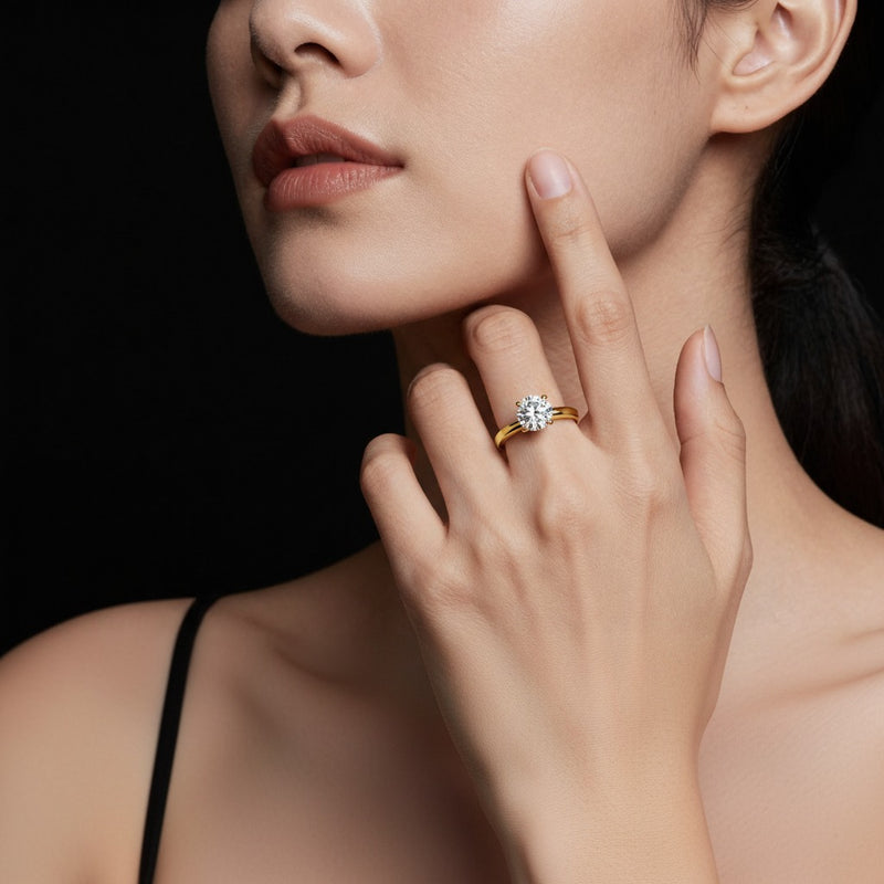 Model wearing round knife edge shank solitaire engagement ring