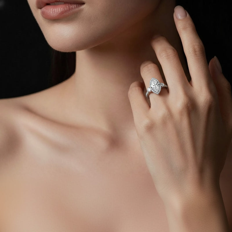Model wearing marquise three stone bold accented engagement ring
