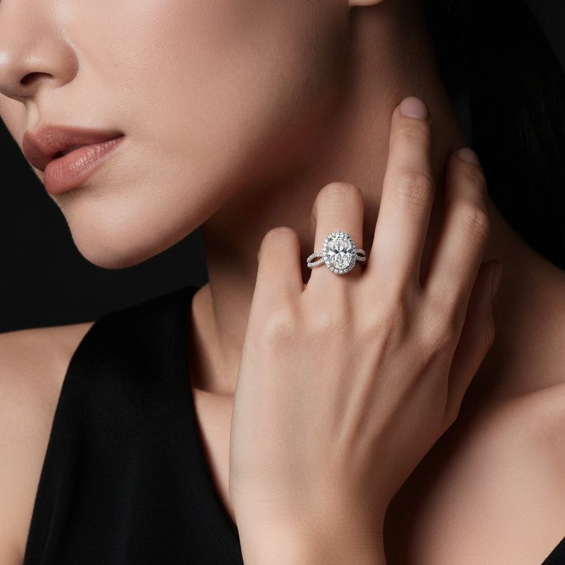 Model wearing oval split shank halo engagement ring