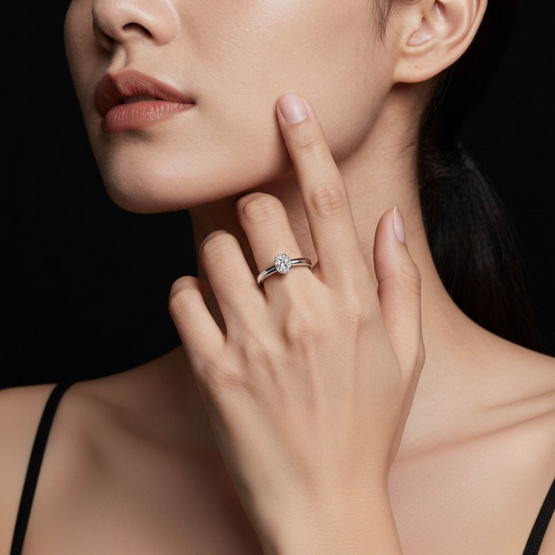 Model wearing oval tulip motif accented engagement ring