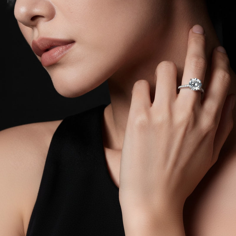 Model wearing round accented bridge shank engagement ring