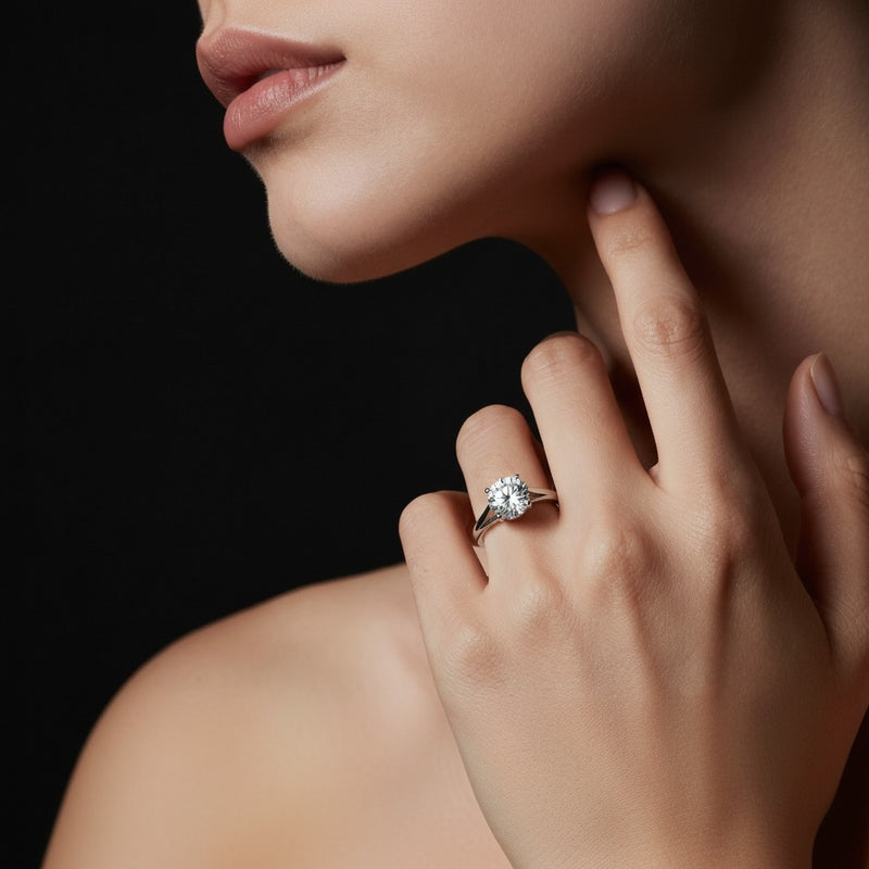 Model wearing round split shank solitaire engagement ring
