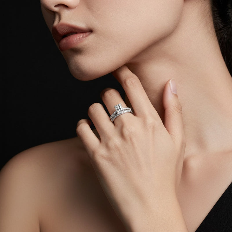 Model wearing emerald classic accented set with band and engagement ring