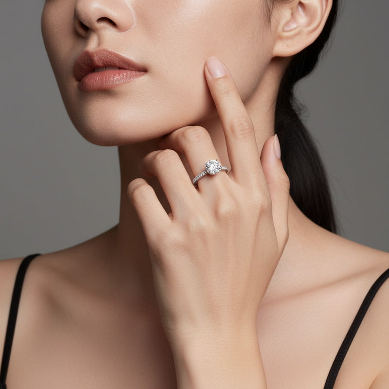Model wearing round halo accented engagement ring