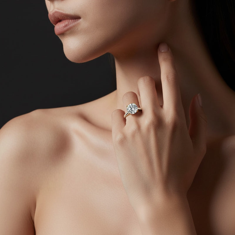 Model wearing round two tone cathedral shank engagement ring