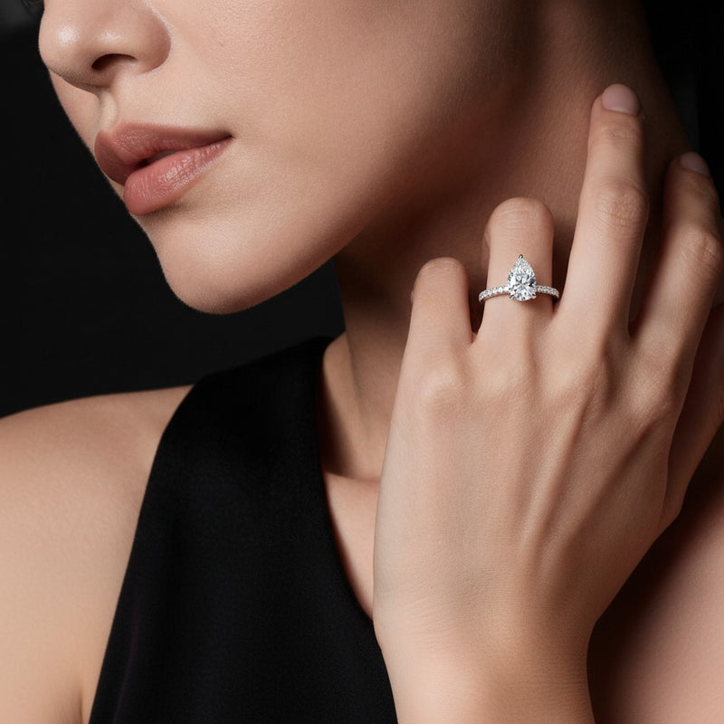 Model wearing pear hidden halo accented ring