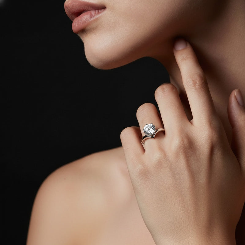 Model wearing round chevron solitaire engagement ring