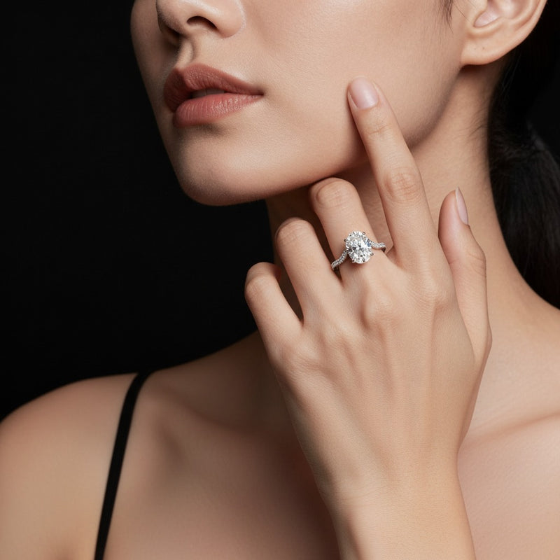 Model wearing pear accented solitaire fancy engagement ring
