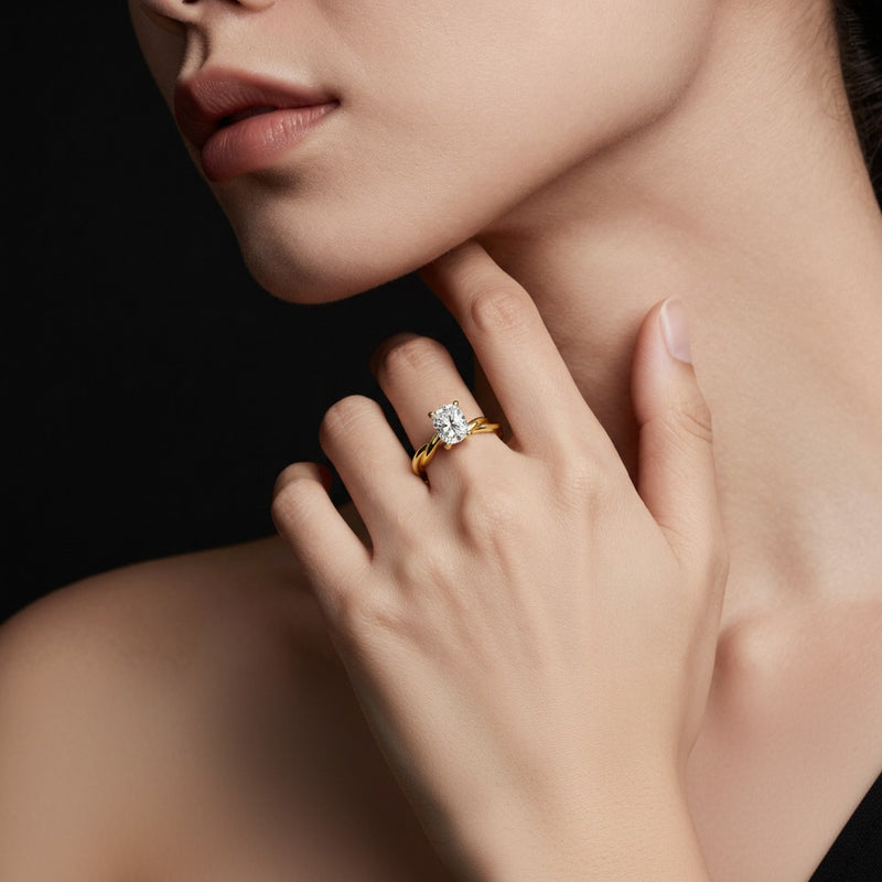 Model wearing cushion twisted shank solitaire engagement ring