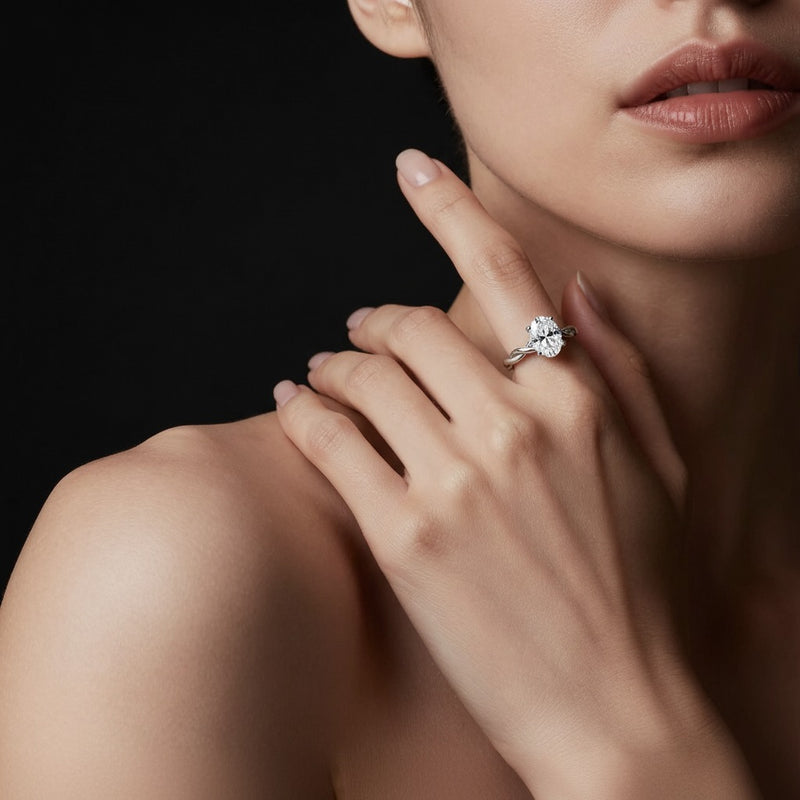 Model wearing oval twisted shank solitaire engagement ring