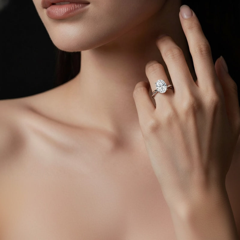 Model wearing oval twisted shank solitaire engagement ring