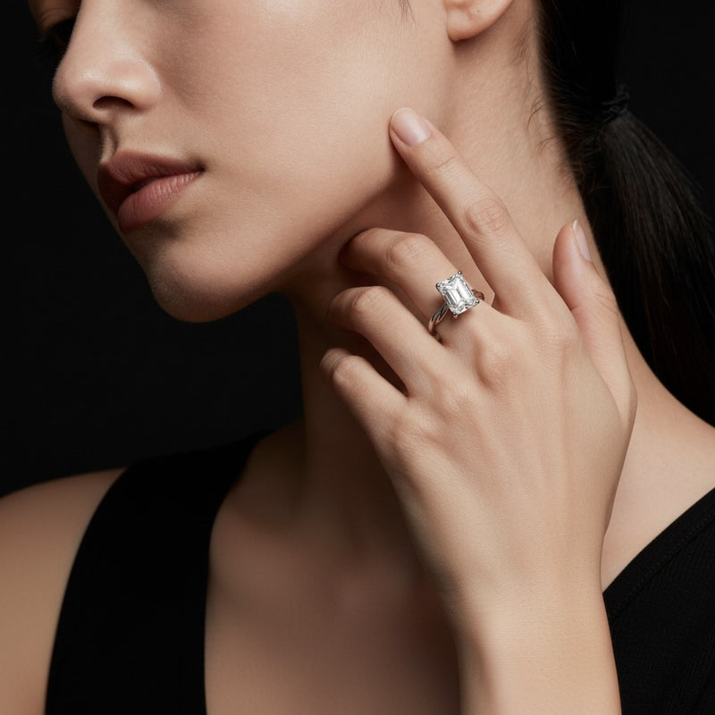 Model wearing radiant twisted shank solitaire engagement ring