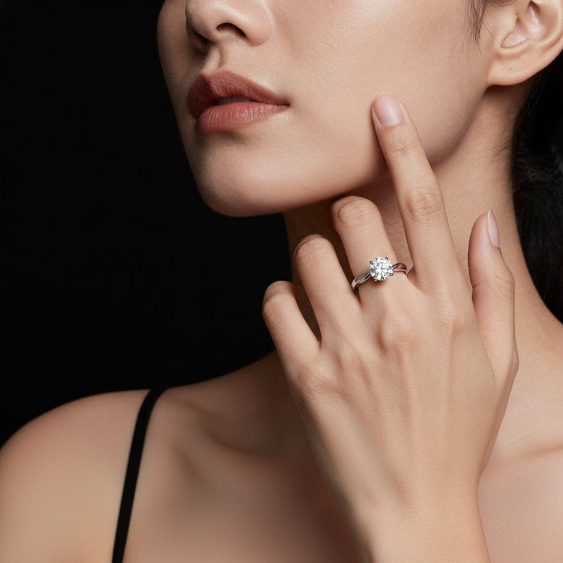 Model wearing round twisted shank solitaire engagement ring