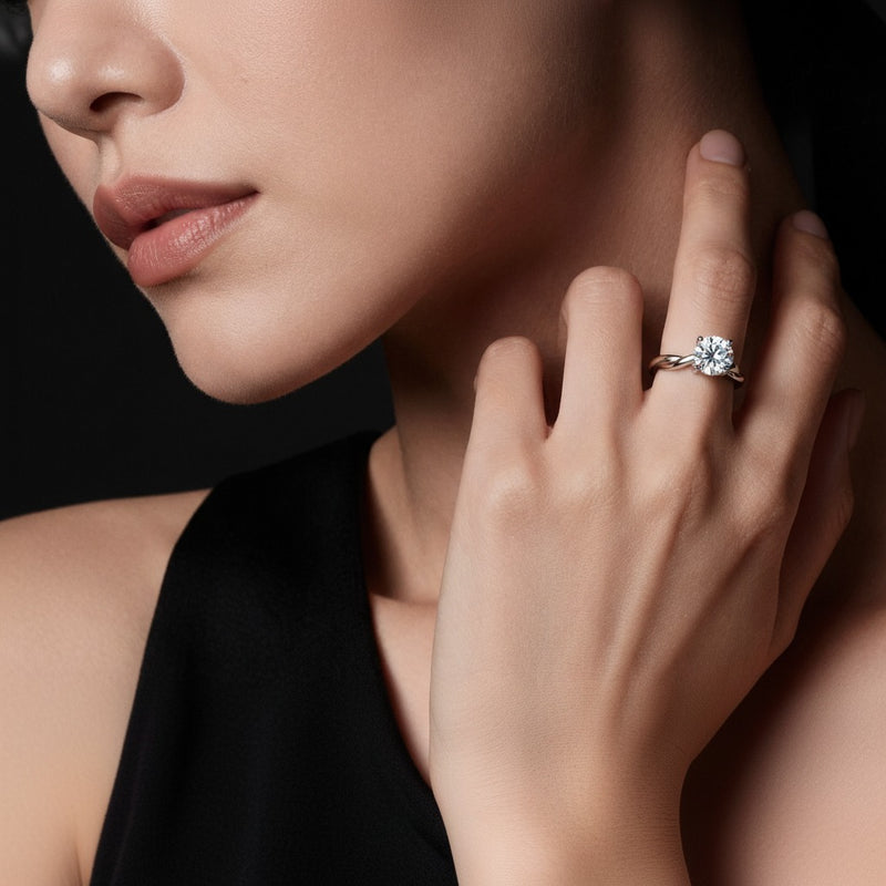 Model wearing round twisted shank solitaire engagement ring