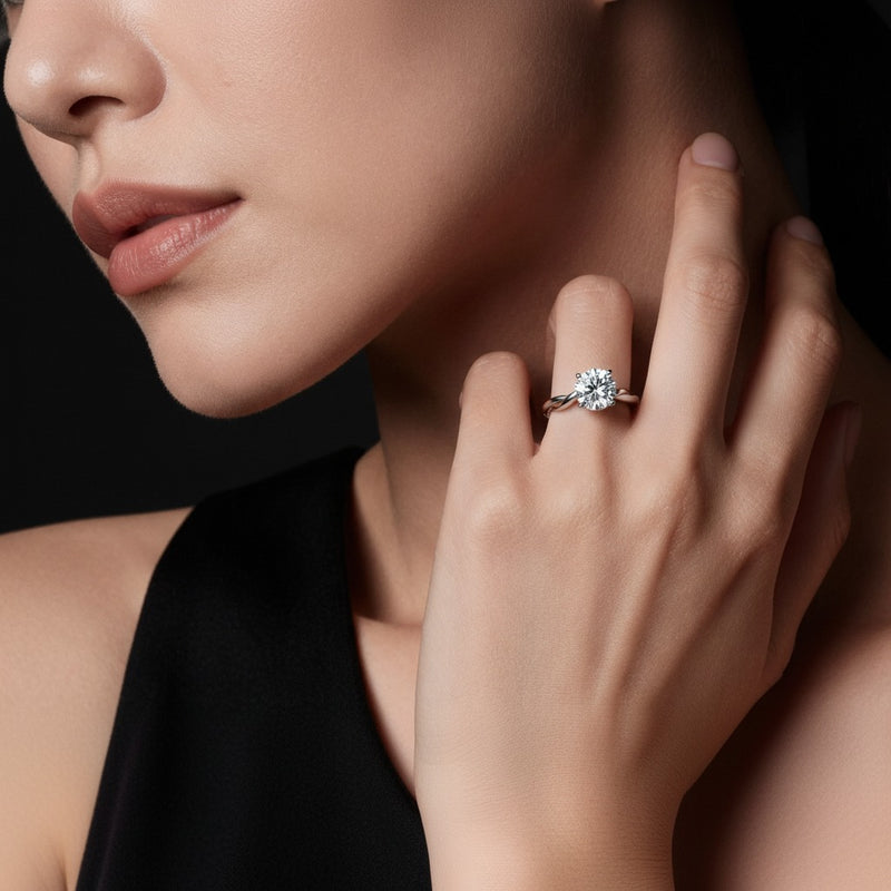 Model wearing round twisted shank solitaire engagement ring