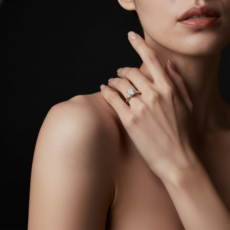 Model wearing round twisted shank solitaire engagement ring