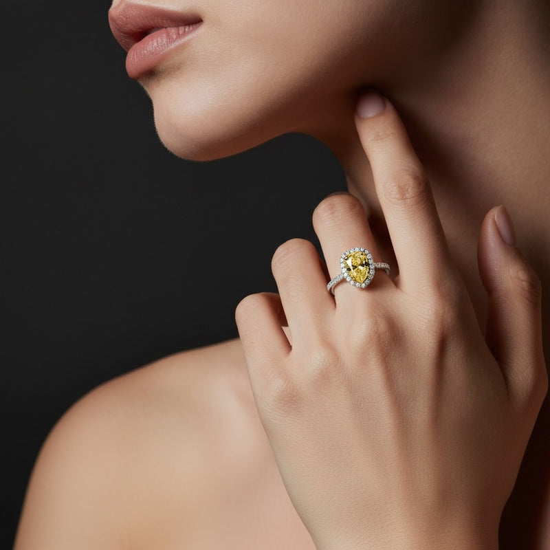 Model wearing emerald toi et moi engagement ring