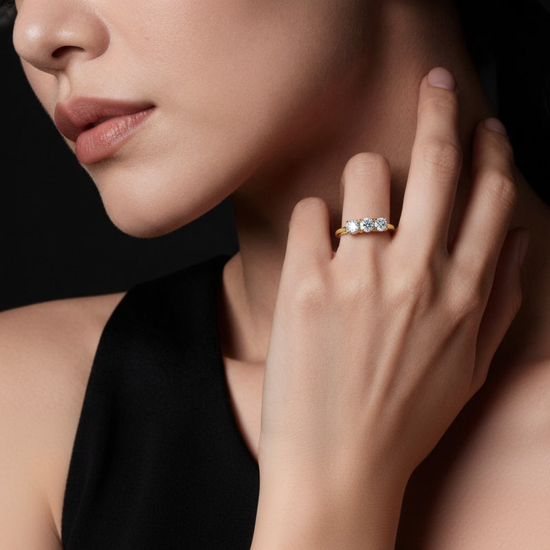 Model wearing round three stone band ring