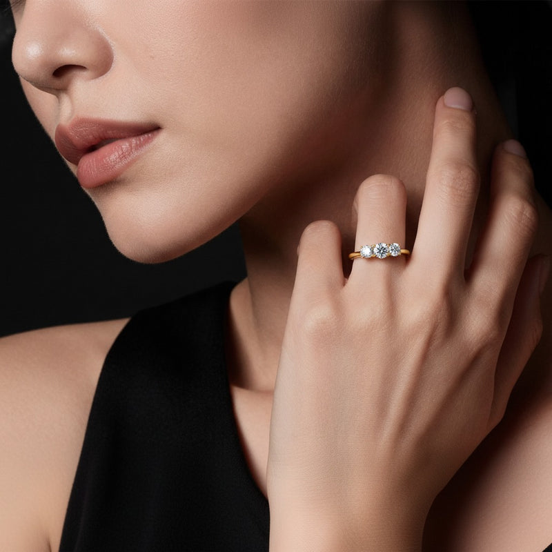 Model wearing round three stone band ring