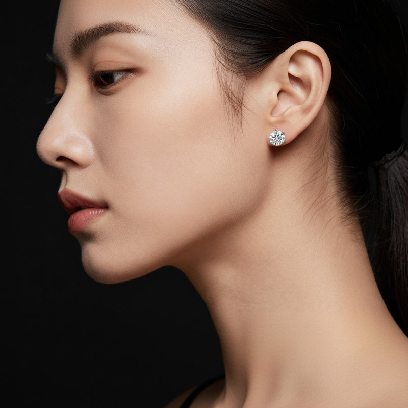 Model wearing round three prong stud earrings