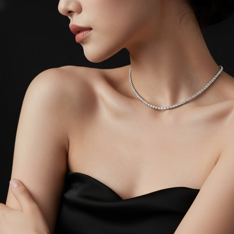 Model wearing round three prong graduating necklace