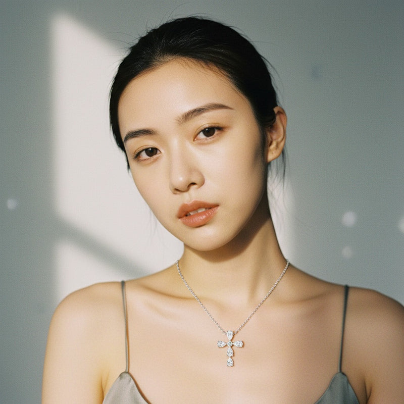 Model wearing pear cross pendant