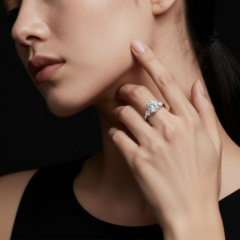 Model wearing round accented three stone ring