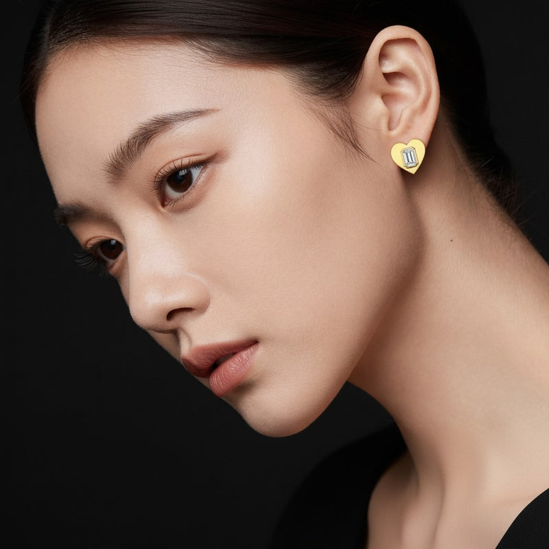 Model wearing heart stud earrings