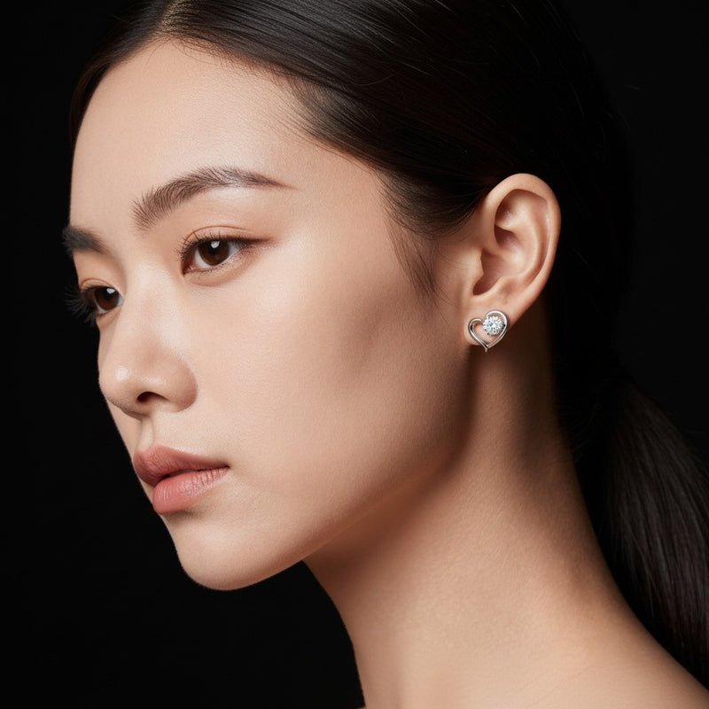 Model wearing heart stud earrings