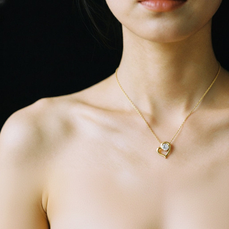 Model wearing heart pendant