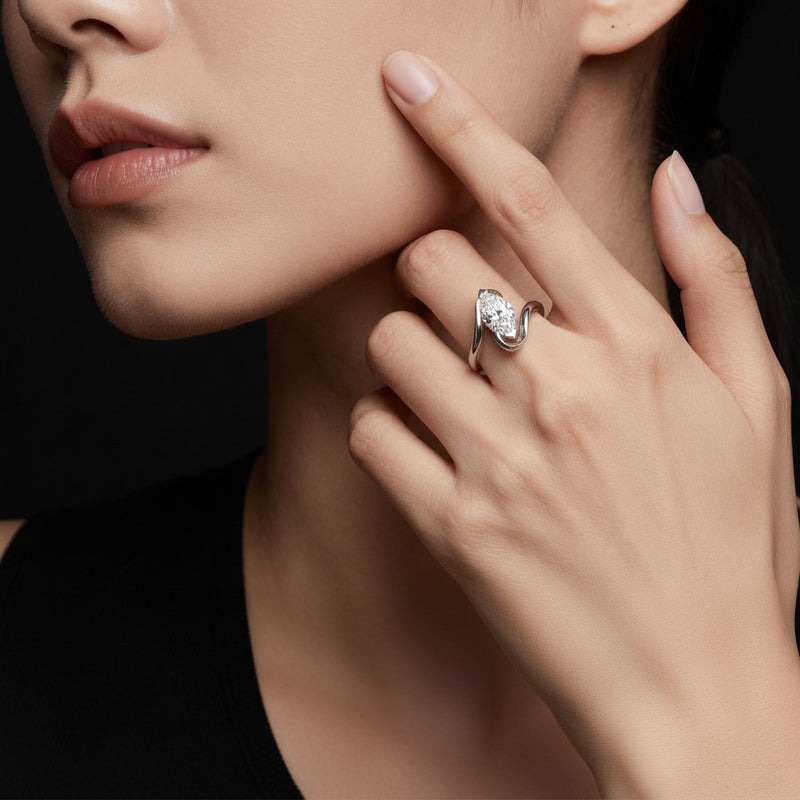 Model wearing marquise swirl engagement ring