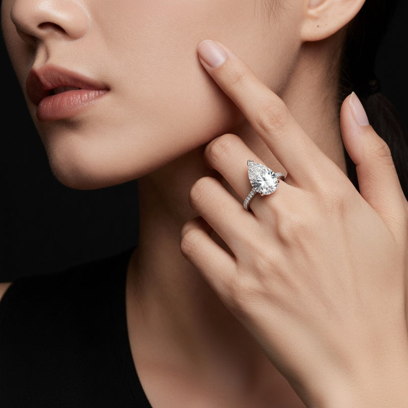 Model wearing pear east west accented ring