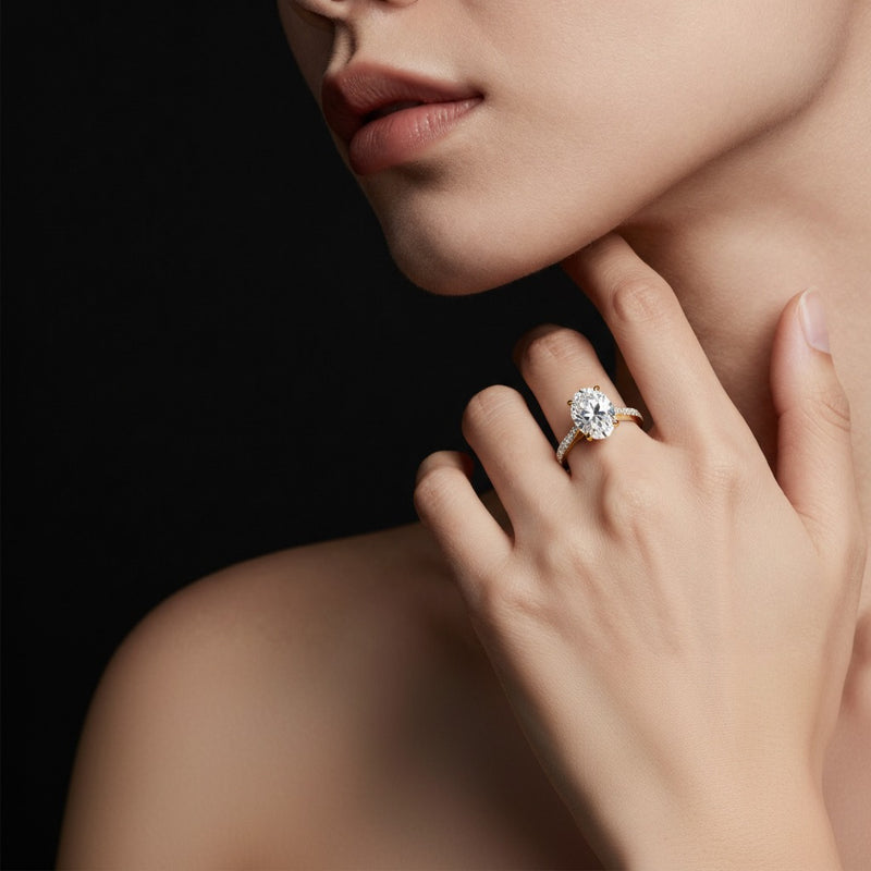 Model wearing oval solitaire engagement ring