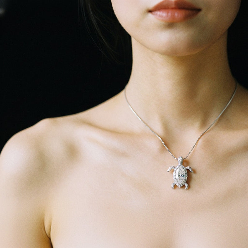 Model wearing marquise accented turtle pendant