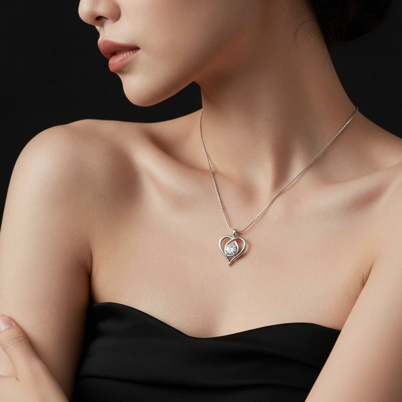 Model wearing heart pendant