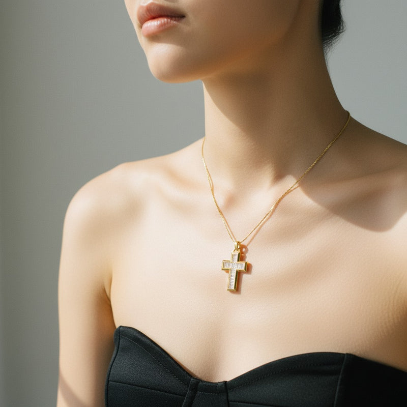 Model wearing emerald cross pendant