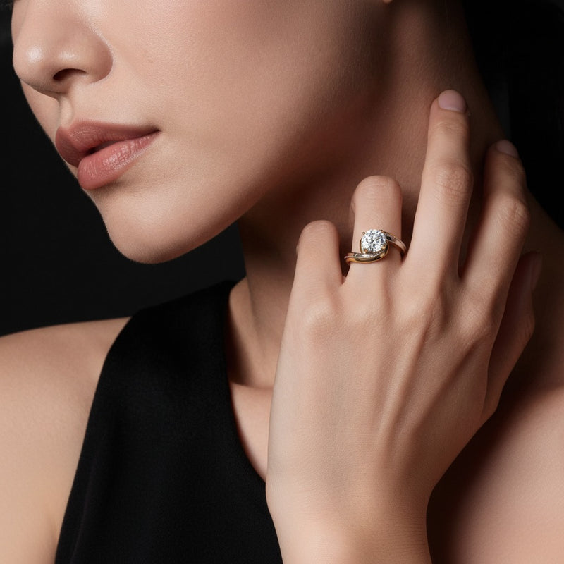 Model wearing round solitaire engagement ring
