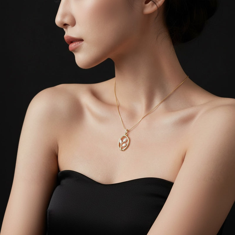 Model wearing oval pendant