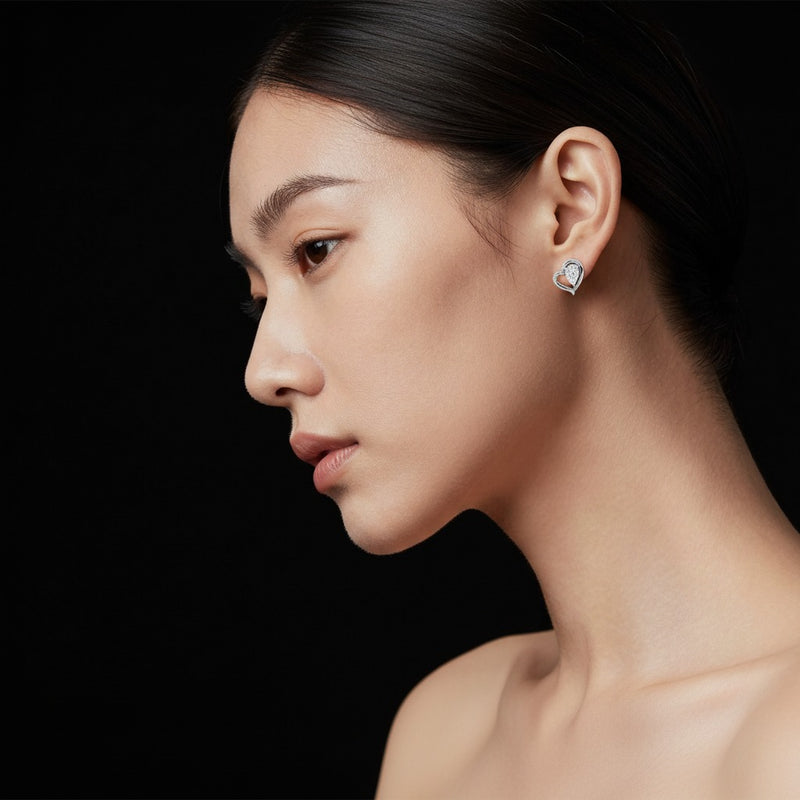 Model wearing heart earrings