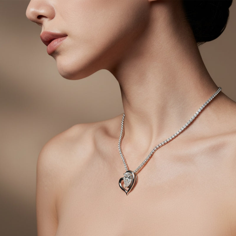 Model wearing pear heart pendant