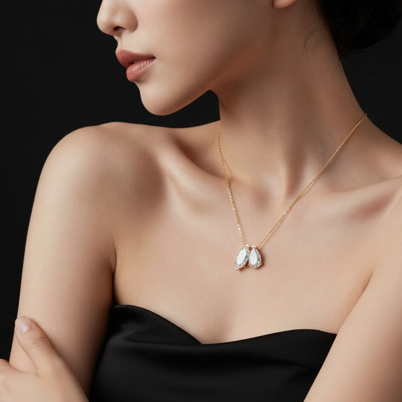 Model wearing pear two stone fancy pendant